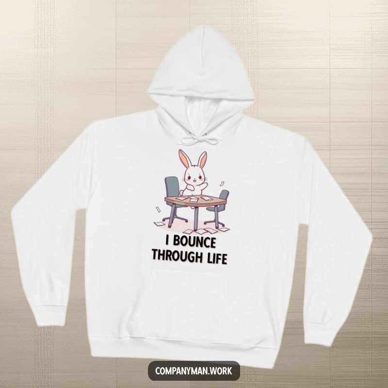 Funny playful bunny hopping onto a miniature conference table, scattering papers, featured on a cozy hoodie for office humor.